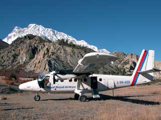 Royal Nepal Airlines plane sits on the gravel at Hungde airstrip as I return from Manaslu